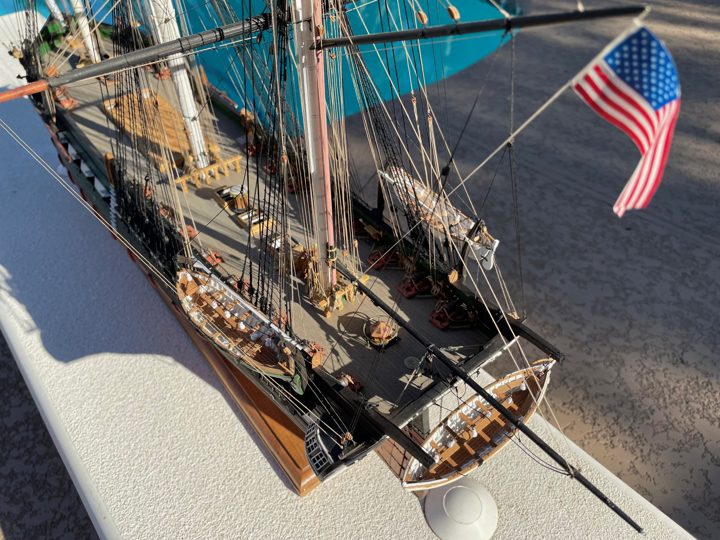 The stern seen from above, with the ship’s boats on their davits and the American flag