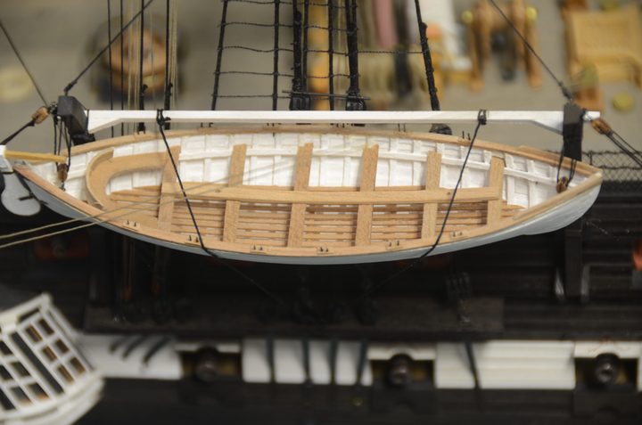 A close-up of the ship's boat on its davits
