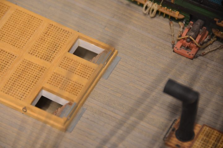 A hatch grating and the galley stovepipe