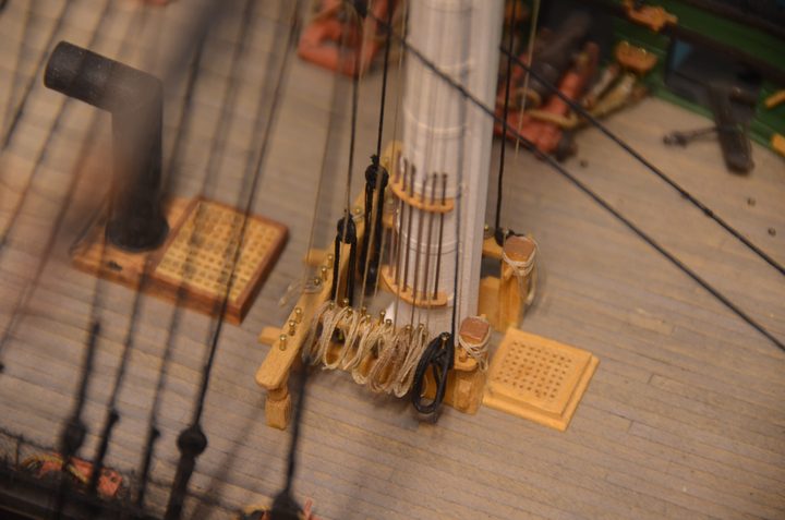 The base of the mast, with boarding pikes, the fife rail, and belaying pins